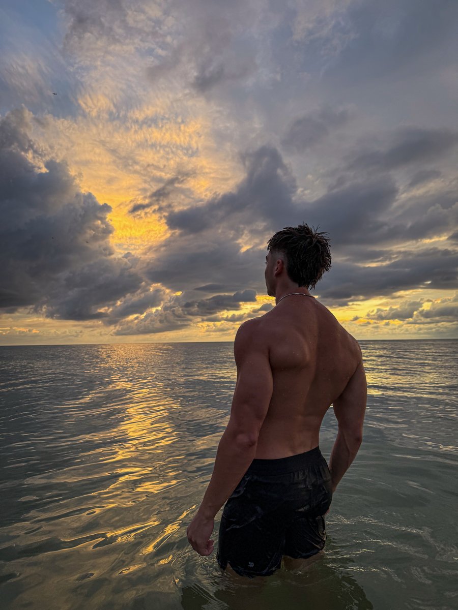Ace Dressler looking out at the ocean at sunset